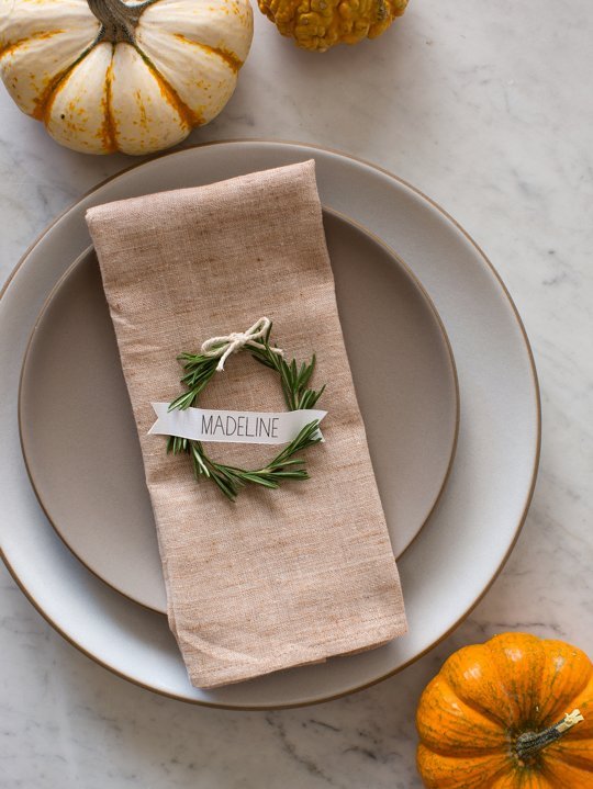 Handwritten place cards contribute a personal touch to holiday tablescapes.