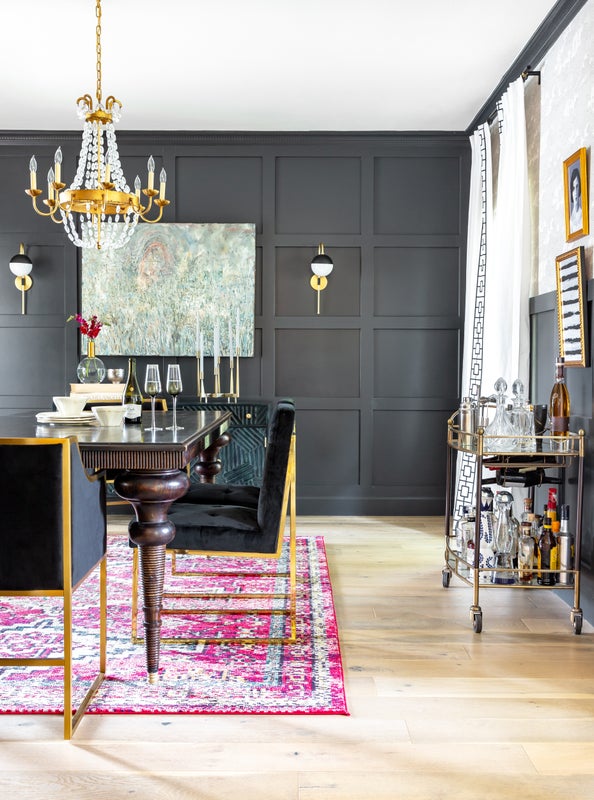 Dining Table with Chandelier and Black accent wall