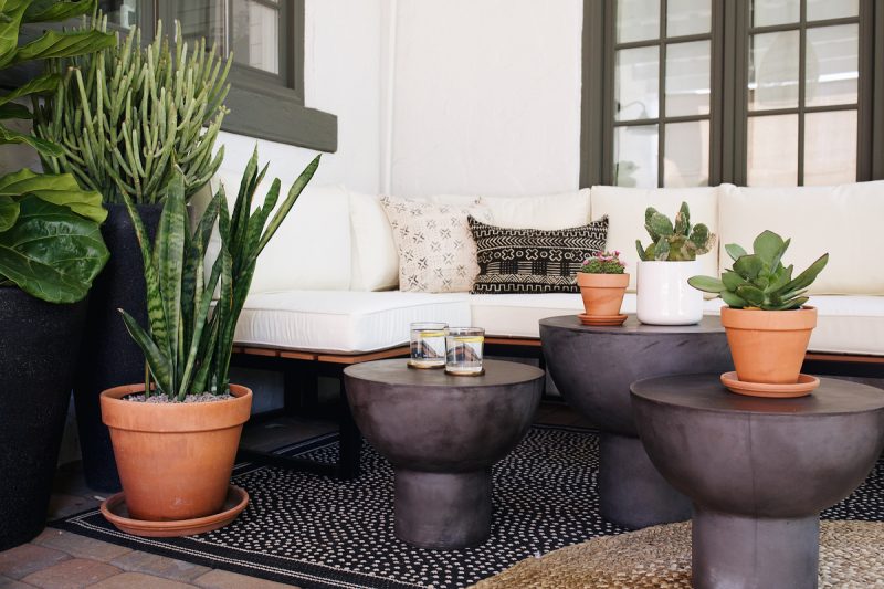 boho patio complete with outdoor plants and planters