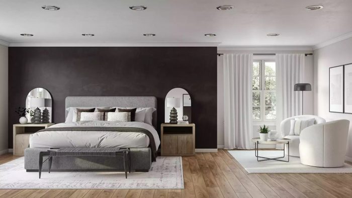 modern black bedroom with two white swivel chairs