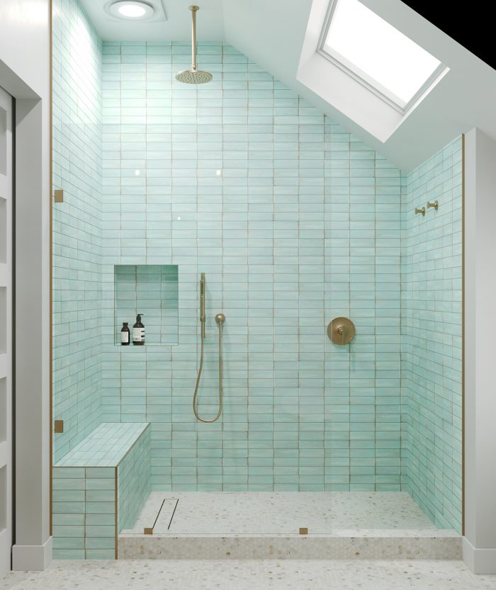 mint green tile shower with brass hardware