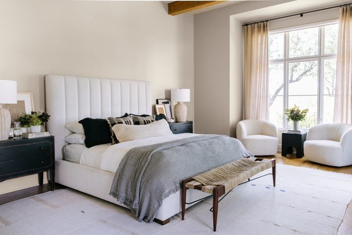 Benjamin Moore Pale Oak in cali cool bedroom with ivory upholstered bed
