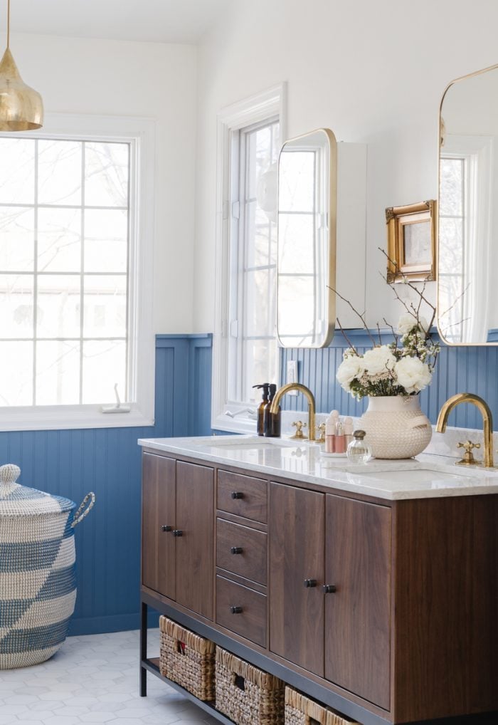 modern vanity with blue wainscotting in bathroom