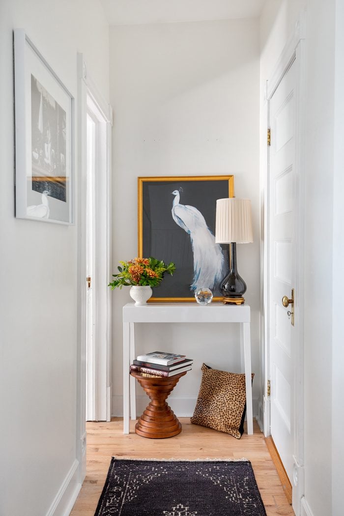 How should I decorate the freakishly long, narrow hallway of my apartment?  It's too narrow to put in a shoe bench comfortably and is about 20-30 feet  in length. - Quora